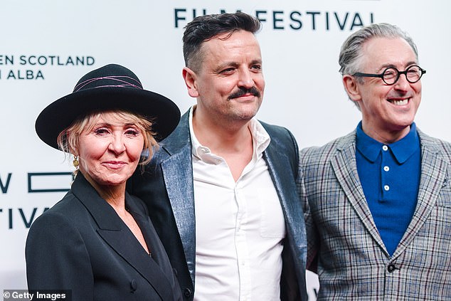 Jono is a filmmaker recognized by BAFTA Scotland for his work (pictured with Lulu and Alan Cummings in 2022 at the premiere of My Old School)