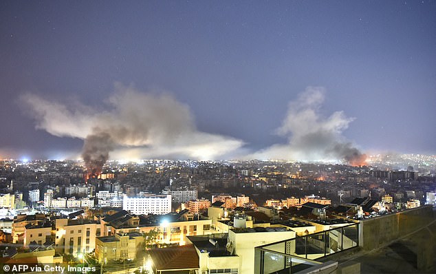 Smoke rises from the site of an Israeli airstrike on a neighborhood in Beirut's southern suburbs on Thursday