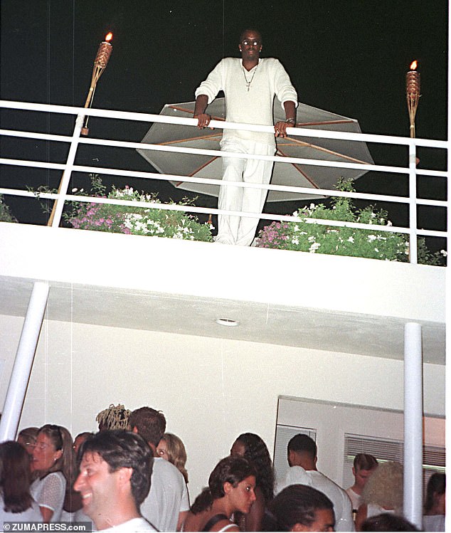 Diddy watches his Labor Day party from his balcony in his East Hampton home in 1998