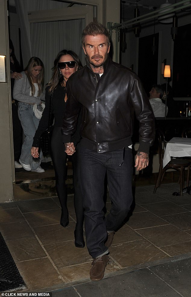 David, meanwhile, was casual chic as he led his wife out of the restaurant