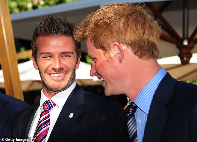 Prince Harry laughs with David Beckham at an FA reception in South Africa in 2010