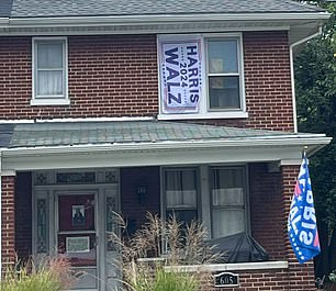 A home sporting Harris-Walz flags