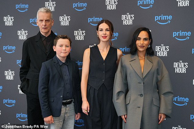 The brunette posed confidently as she graced the carpet with co-stars Peter Capaldi, Benjamin Chivers and Saffron Hocking (pictured from left to right)