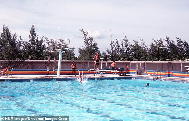 US Naval Construction Battalion - known as the Navy "Sea bees" - bathing by the pool on Diego Garcia in an archive image from 1981