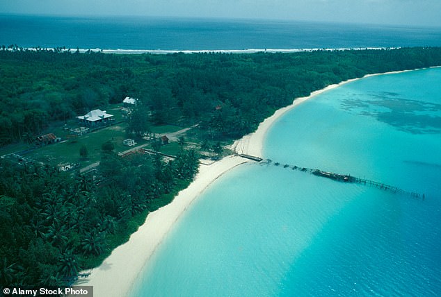 Aerial view of road buildings and forests in the Diego Garcia Islands in the Indian Ocean