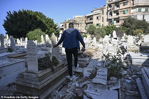 A view of the damage to the cemetery after Israeli warplanes struck a building in the Bachoura area of ​​Beirut, Lebanon