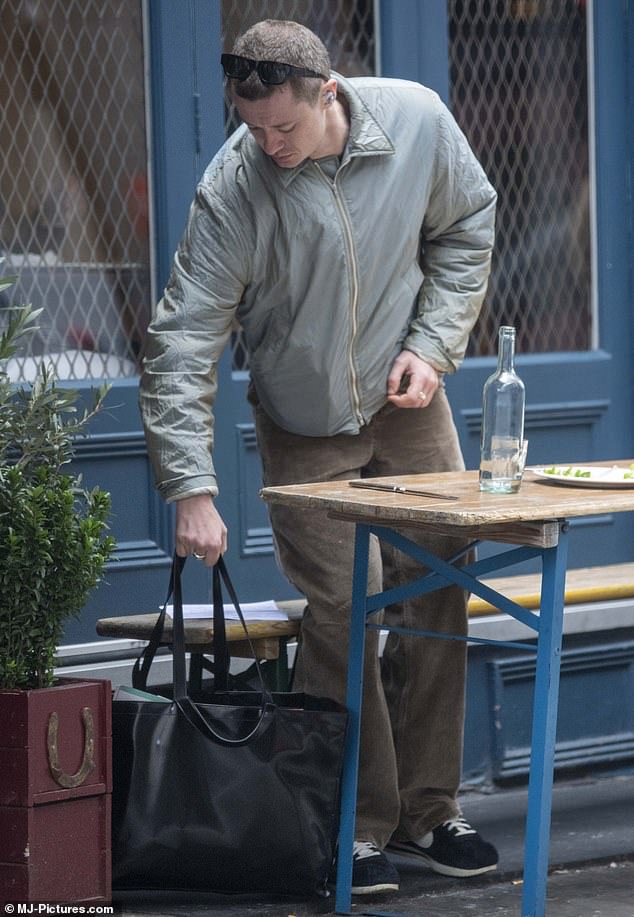 The star, who plays Eddie Munson in the Netflix series, packed his essentials into a £510 Acne Studios tote bag.