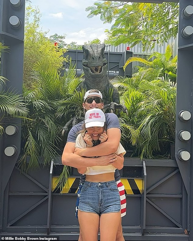 The couple embraced their new status during a celebratory trip to Universal Studios days after the wedding, with Millie showing off shorts that said 