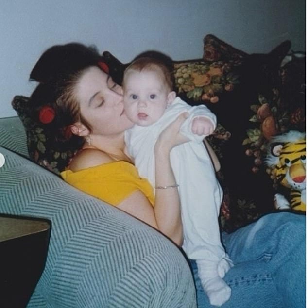 Riley also shared this photo of herself as a baby in her mother's arms