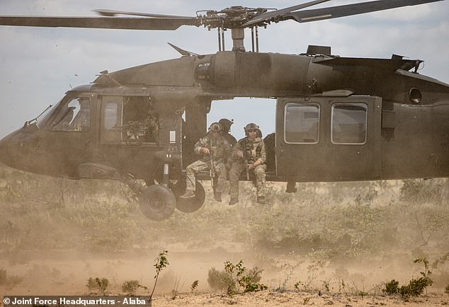 Operators from the 20th Special Forces Group conduct an air assault mission during a training exercise near Chester Township, Michigan, on August 6, 2022. The mission was part of Northern Strike, an annual multinational joint training event headquartered at Camp Grayling Joint Maneuver Training. Center in Michigan