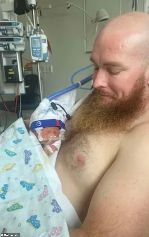 Luna (pictured with dad Scott) didn't meet her mother until she was eight days old