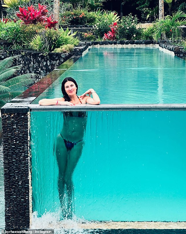 The following photos show the amazing infinity pool at the resort where the couple stayed. Lush, tropical greenery surrounded the pool