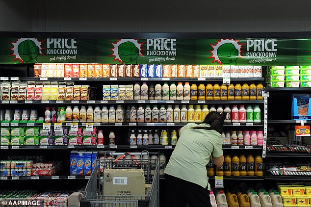 Many consumers may miss shrinking inflation if they don't keep an eye on prices or grocery sizes as they do their weekly shopping (pictured, a Woolworths in Brisbane)