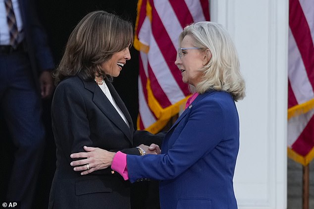 Democratic Vice President Kamala Harris (left) and former Republican Rep. Liz Cheney (right) greet each other on stage during a campaign event at a Ripon College in Ripon, Wisconsin. Ripon is the birthplace of the Republican Party