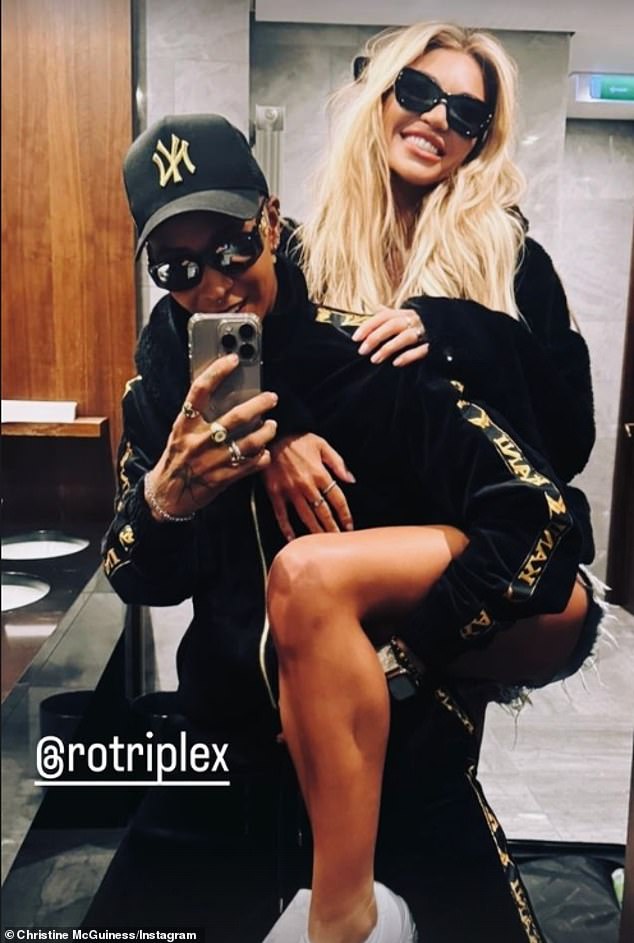 The blonde beauty shared a photo of her and the model getting cozy, with Christine standing behind Roxxxan, 33, beaming as Roxxxan lifted her leg