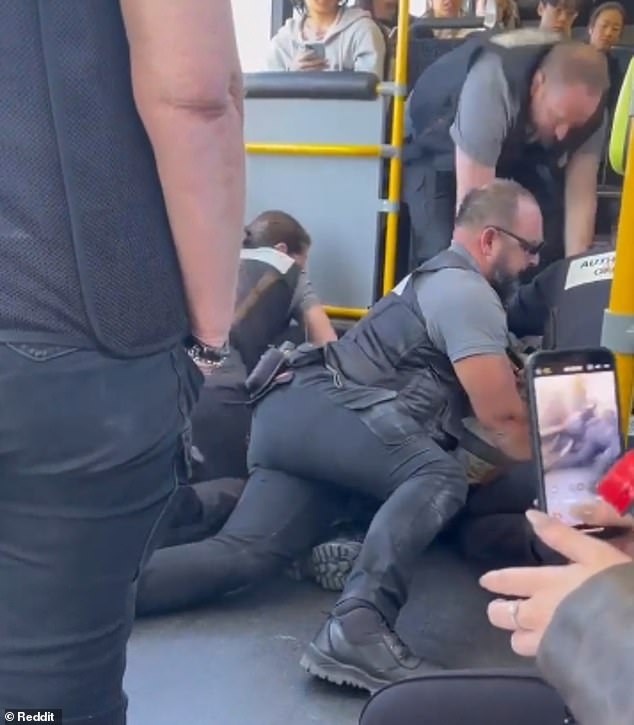 Video footage shows five PTV officers restraining a 24-year-old man on the 601 bus from Huntingdale to Monash in the city's south-east on Wednesday (pictured)