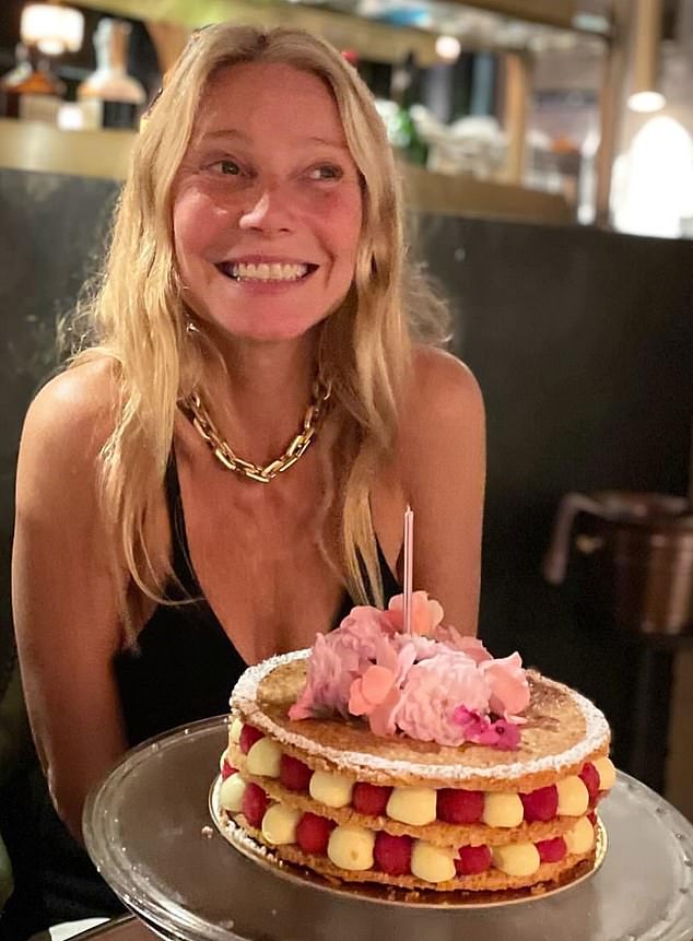 Gwyneth Paltrow shared this photo online of her posing at a local brasserie with a tiered birthday cake