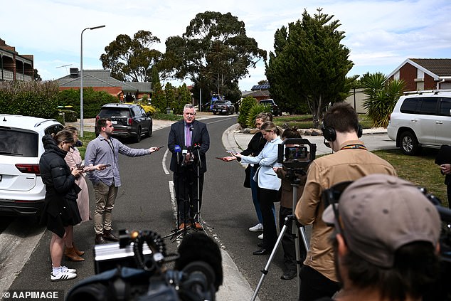 Reporters gathered at the crime scene where Inspector Thomas addressed them