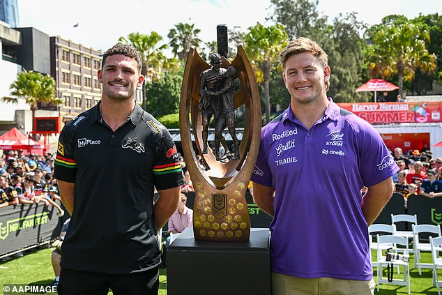 Pictured: Skippers Nathan Cleary and Harry Grant pose with the premiership trophy