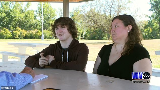 Dutcher, pictured with his mother Catherine, said during the chase he thought to himself: 'I'm going to die tonight'