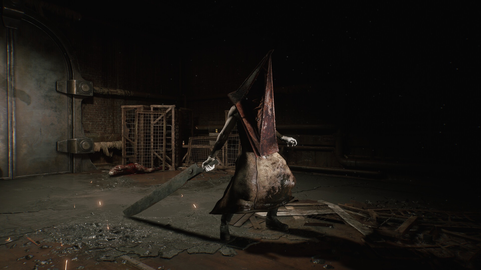 Pyramid Head stands in the darkness and holds a huge blade