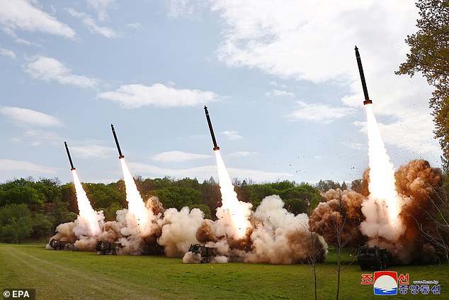 A photo released by the official North Korean Central News Agency (KCNA) shows missiles launched during a simulated nuclear counter-attack exercise at an unknown location in April