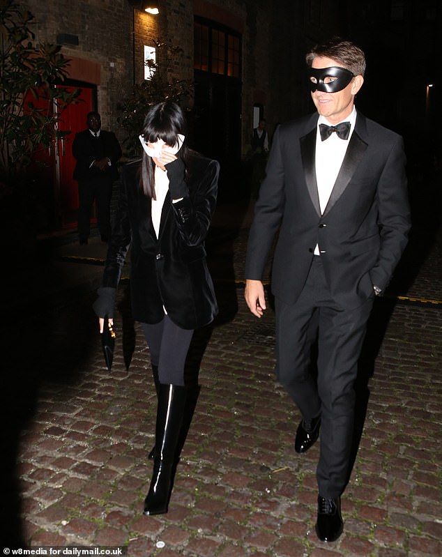 In keeping with the masquerade theme of the event, she and Kris both wore matching masks as they entered the party.