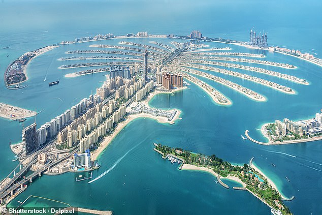 The news has thrown travel plans into chaos for thousands of people, leaving Britons stranded in the Middle East as the war threatens to boil over. In the photo: the Dubai Palm