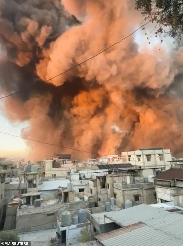 Smoke rises over buildings in Beirut, Lebanon on September 27 after an airstrike