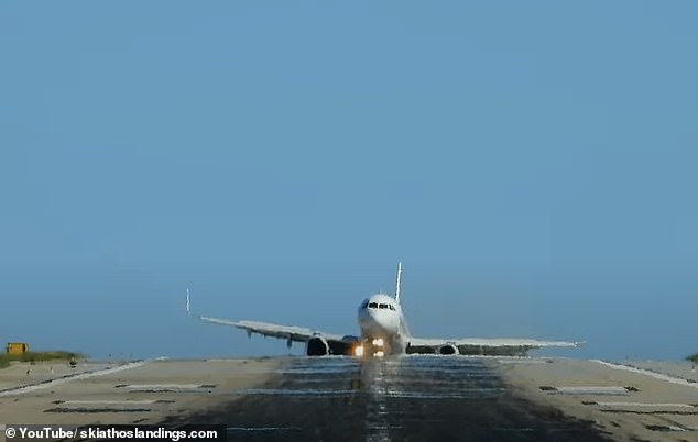 The plane then lands with some force as the Airbus A321-200 jerks to the side as it crashes into the runway - apparently nose first - before reappearing above the runaway's forehead after safely reaching solid ground.