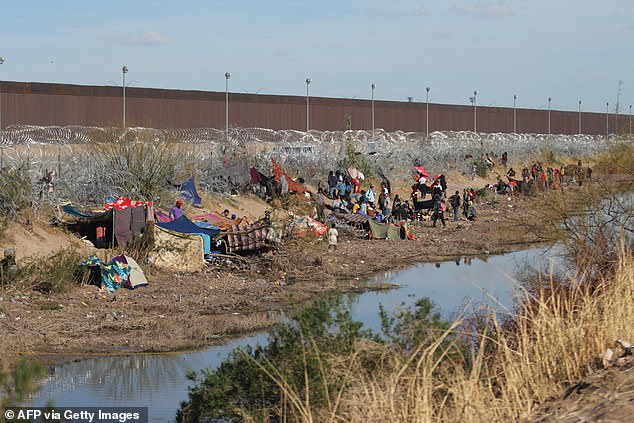 Migrants seeking asylum in the United States wait at the border of Ciudad Juarez, Chihuahua state, Mexico, on March 19, 2024