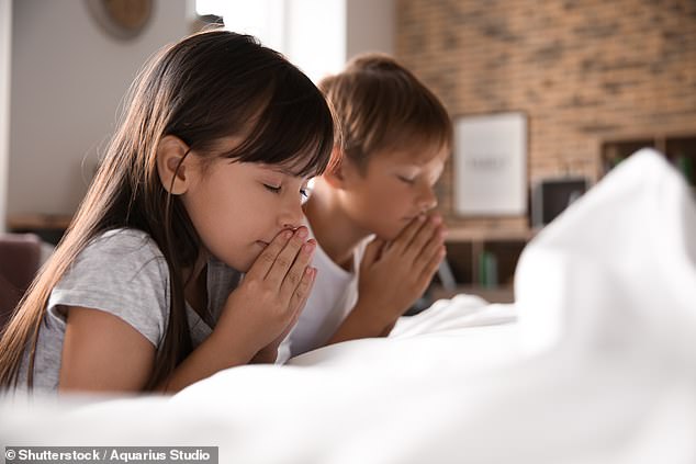 Britain is entering its first 'atheist age' as parents fail to pass on their religious beliefs to their children, a study says (stock image)