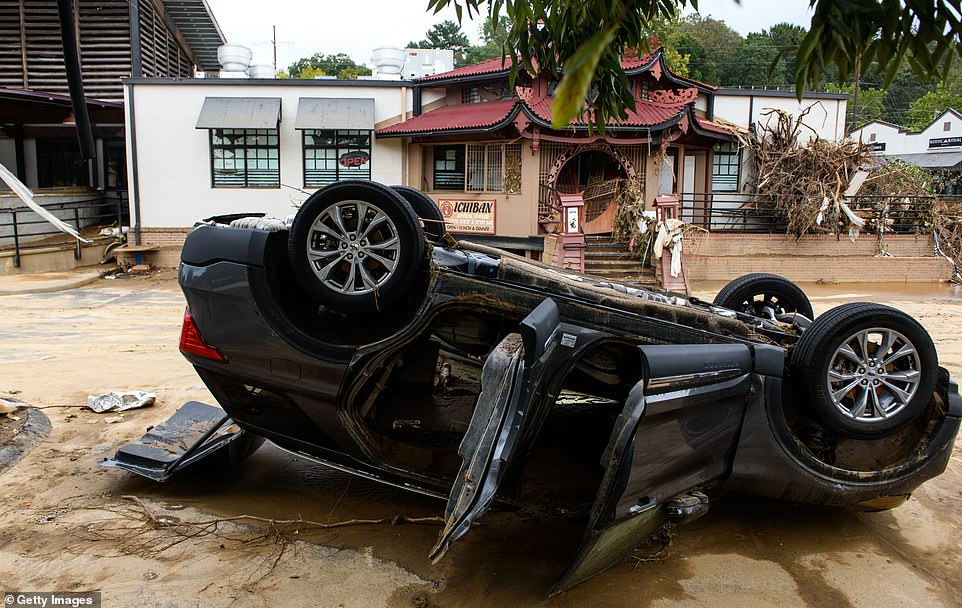 The floods covered signs and windows and even reached above the hoods of cars and trucks