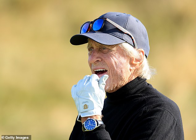 The actors looked sharp as they made their way around the course in St Andrews, Scotland, on Friday, with Michael (pictured) focusing on his swing