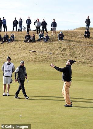 The star threw his golf club in the air to celebrate a good swing