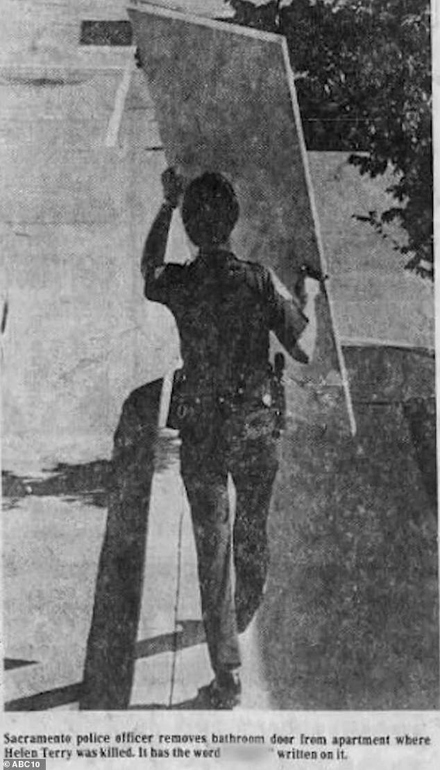 A newspaper clipping of a Sacramento police officer removing the bathroom door from the apartment where Terry was murdered. The racist comments written on the wall were muzzled in the news clipping