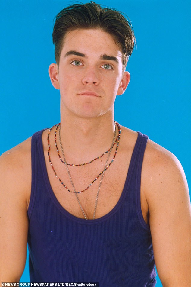 Robbie pictured as a pop singer when he starred in Take That in 1992