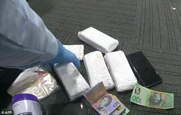 When searching the man's bag, officers reportedly found $70,000 in suspected illegal cash, a glass pipe and a sealed bag containing a crystalline substance (pictured)