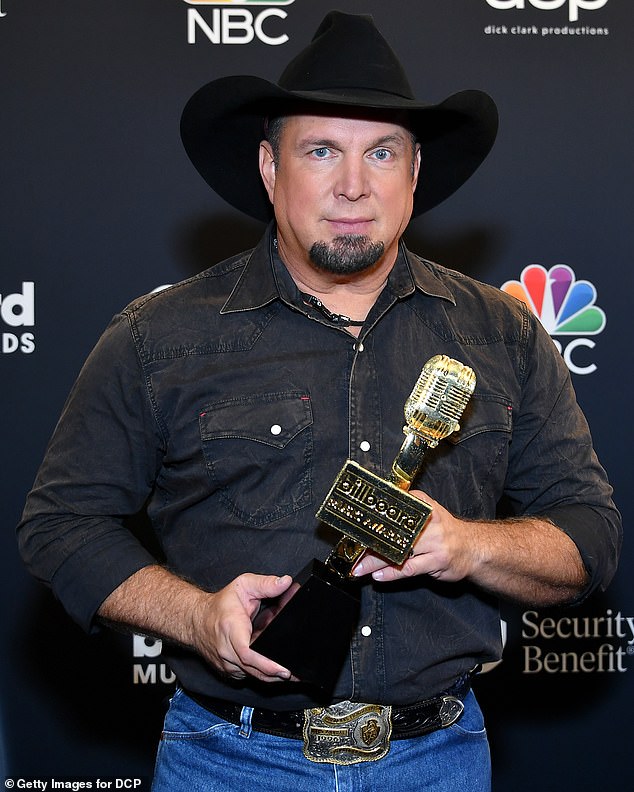 Brooks is pictured at the 2020 Billboard Music Awards, with an Icon Award