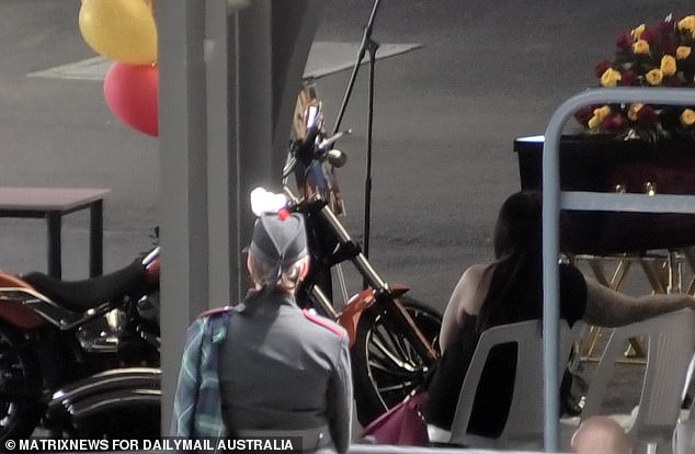 Members also parked one of Mr Martin's beloved Harley Davidson motorcycles next to the coffin while the proceedings took place.