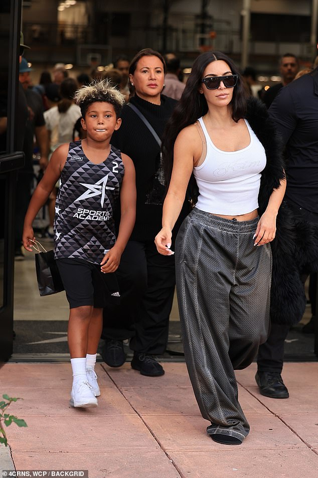 After watching Saint, eight, run up and down the field for his team, mother and son eventually emerged through the same door for the short walk back to her parked vehicle.