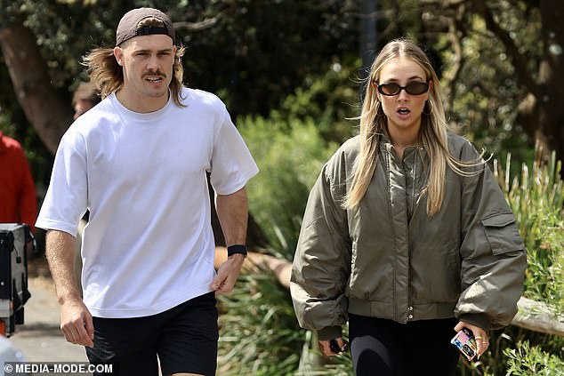 The pair seemed delighted to be in each other's company and smiled as they walked down the leafy street in Sydney