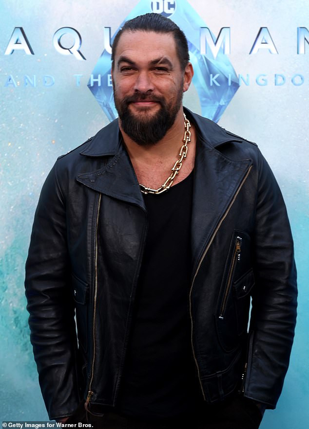 In five images, the Blink Twice actress wore a form-fitting, cream-colored dress with short sleeves and tiny flower-like eyes all over; Momoa pictured in December 2023