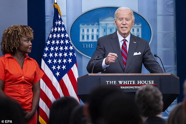 US President Joe Biden responds to a question from the news media together with White House Press Secretary Karine Jean-Pierre during the daily briefing at the White House