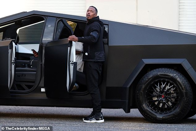 The comedian wore matching sweatpants and statement high-top sneakers to complete his look