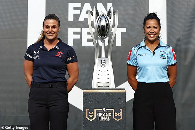 Jessica Sergis of the Hanen and Tiana Penitani of the Sharks with the NRLW trophy