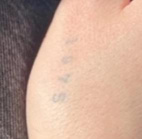 Brooklyn had his father's birth year tattooed above his thumb in a simplistic font