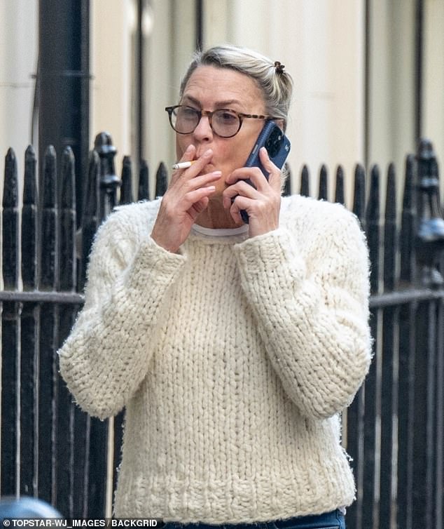 Wearing a cream cable-knit sweater paired with stylish faded jeans, Wright appeared engrossed in a phone conversation as she chatted animatedly as she walked down the sidewalk