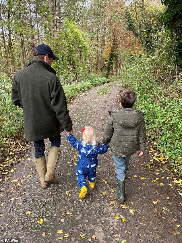 Beatrice, 36, shared a photo of Edo, Sienna and Wolfie walking through the woods