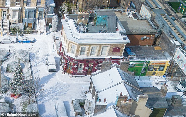 Outside the famous Queen Vic, two large nutcrackers stood at the double doors of the pub